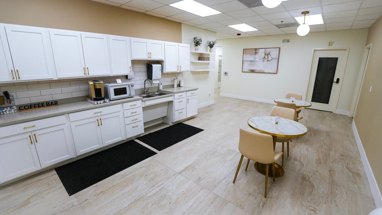 Break room with coffee bar and cafe tables